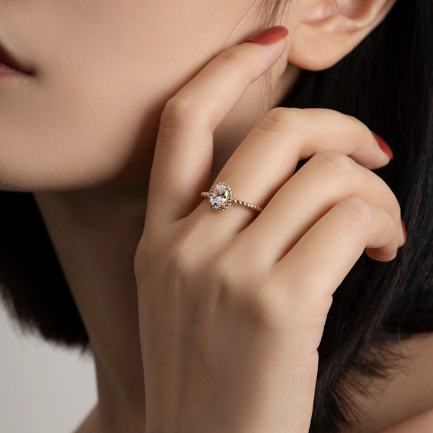 Dissoo® Yellow Gold Oval Cut Twisted Solitaire Bezel Engagement Ring