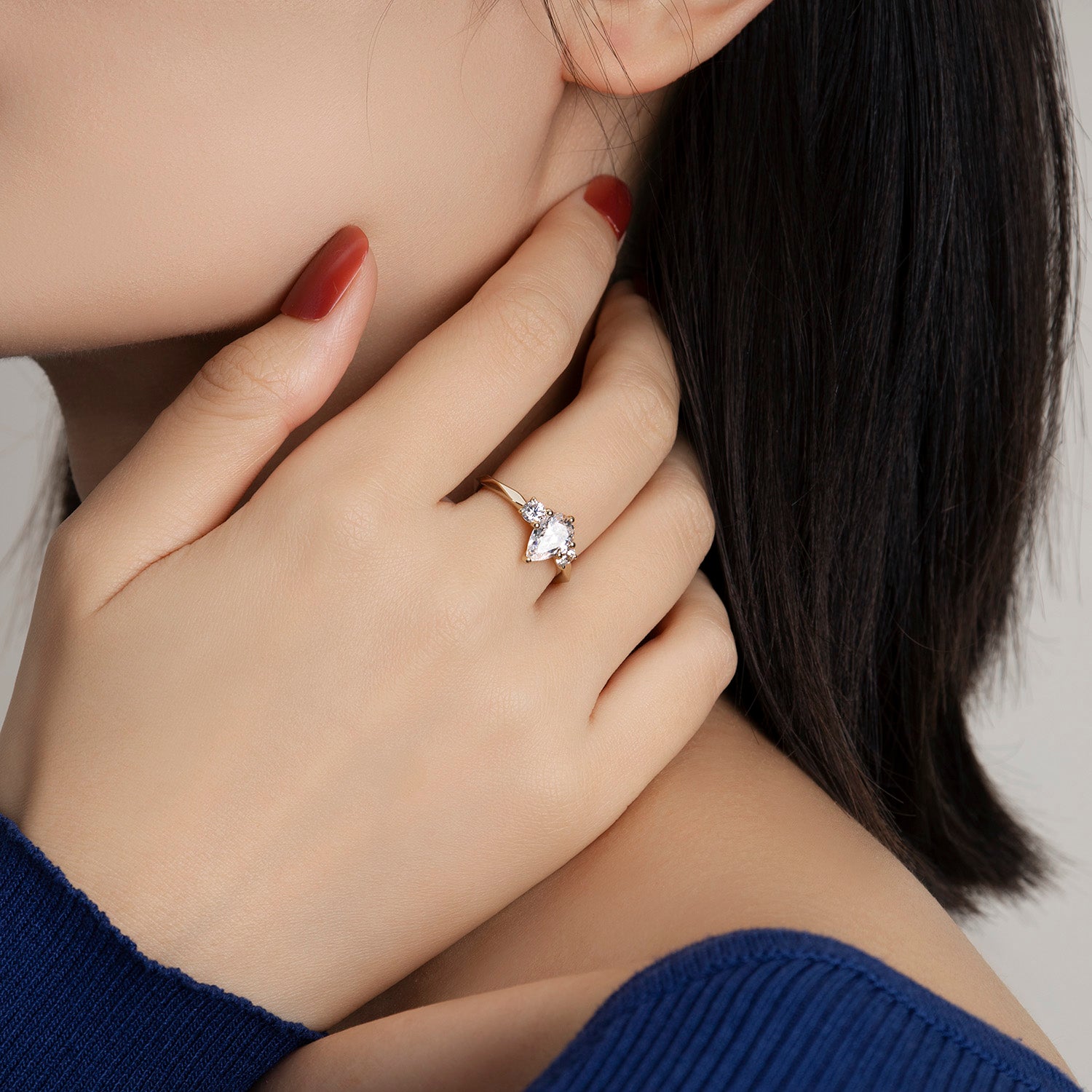 Dissoo® Yellow Gold Three-stone Pear Multi-faceted Moissanite Engagement Ring