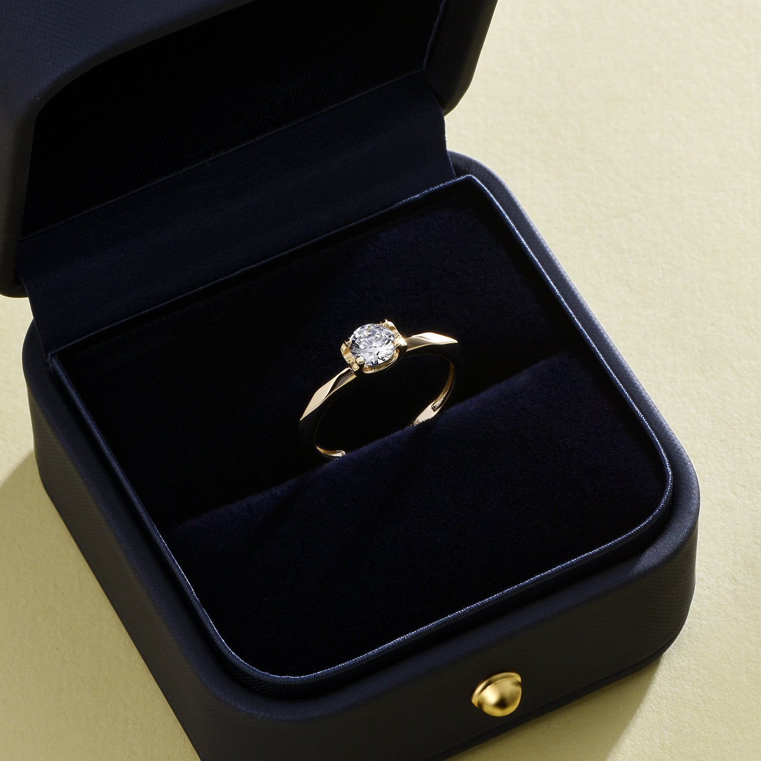 Dissoo® Round Multi-faceted Moissanite Engagement Ring in Gold Vermeil