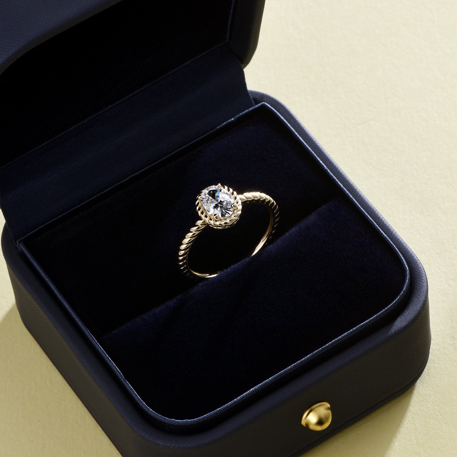 Dissoo® Yellow Gold Oval Cut Twisted Solitaire Bezel Engagement Ring