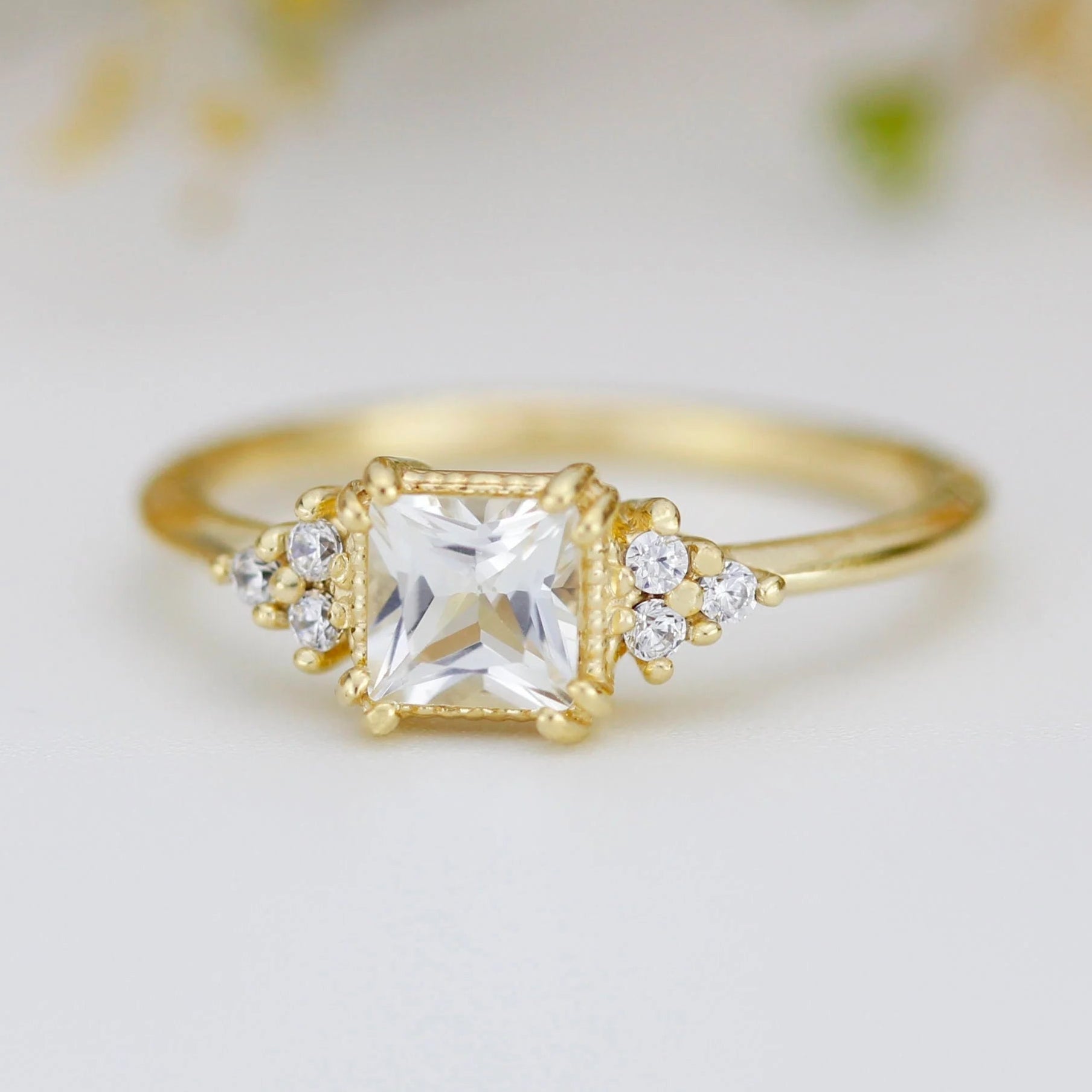 The Gisella Asscher Cut Moissanite Cluster Engagement Ring