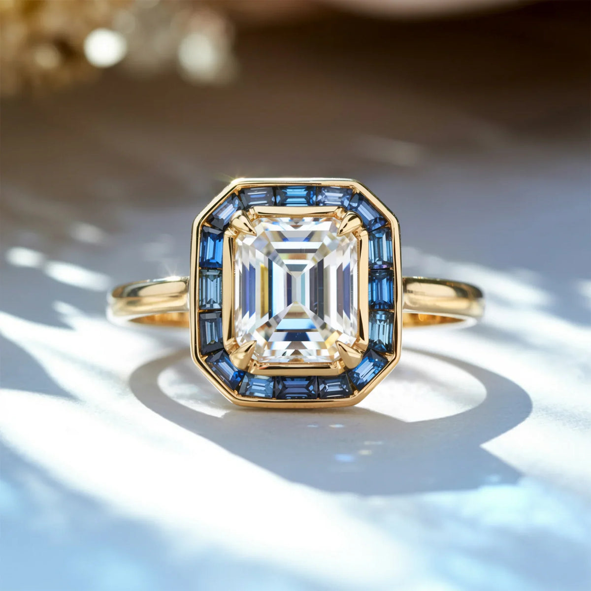 The Indigo Whisper 1CT Emerald Cut Halo Moissanite Ring