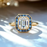 The Indigo Whisper 1CT Emerald Cut Halo Moissanite Ring