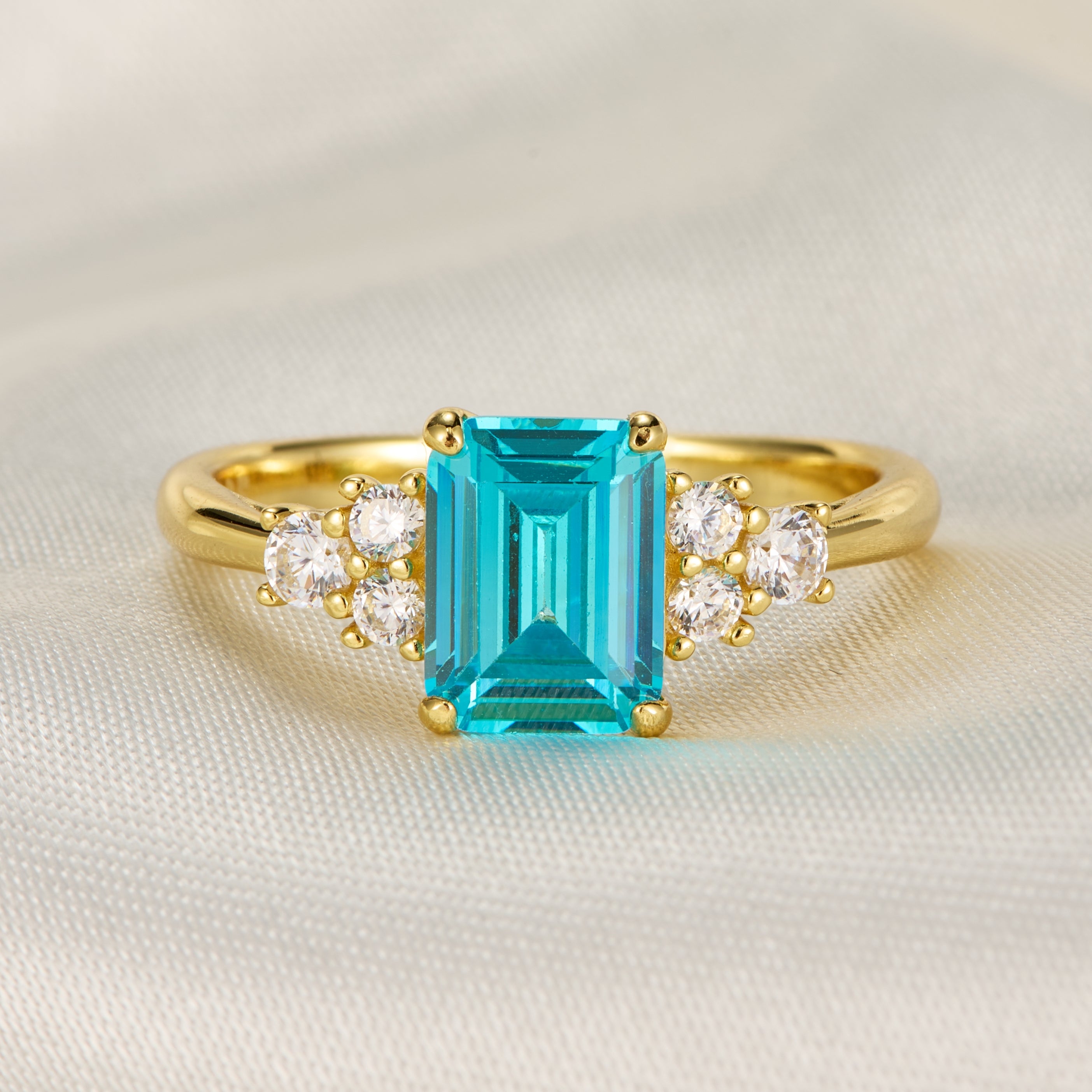 Carina Emerald Cut Topaz Engagement Ring