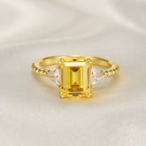 The Elowyn Emerald Cut Lab-Grown Yellow Sapphire Engagement Ring