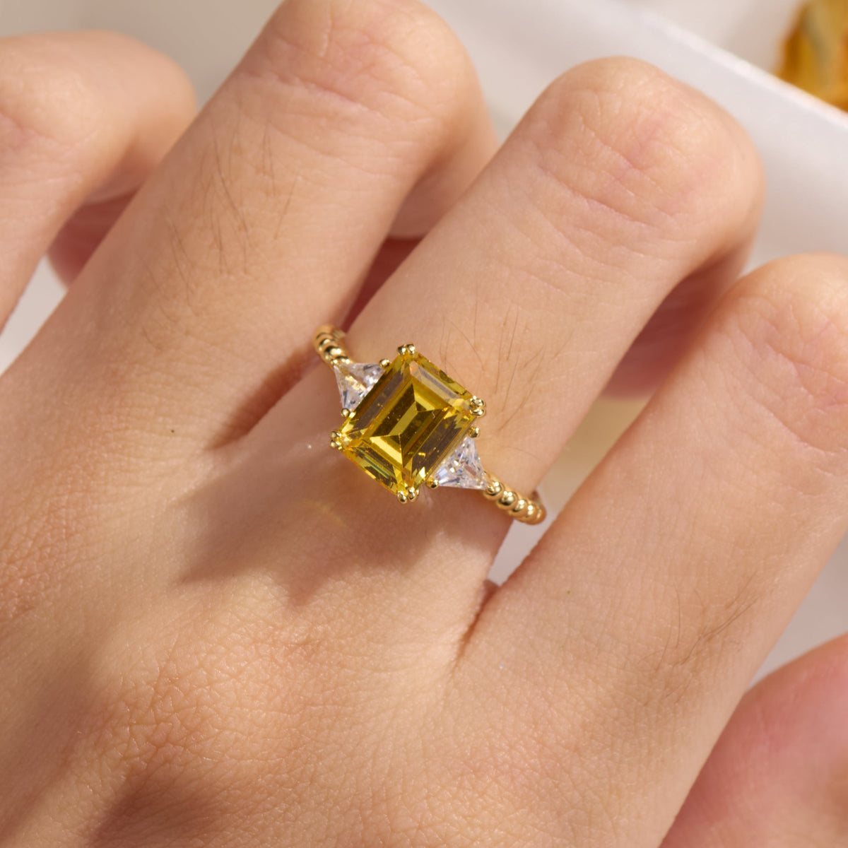 The Elowyn Emerald Cut Lab-Grown Yellow Sapphire Engagement Ring