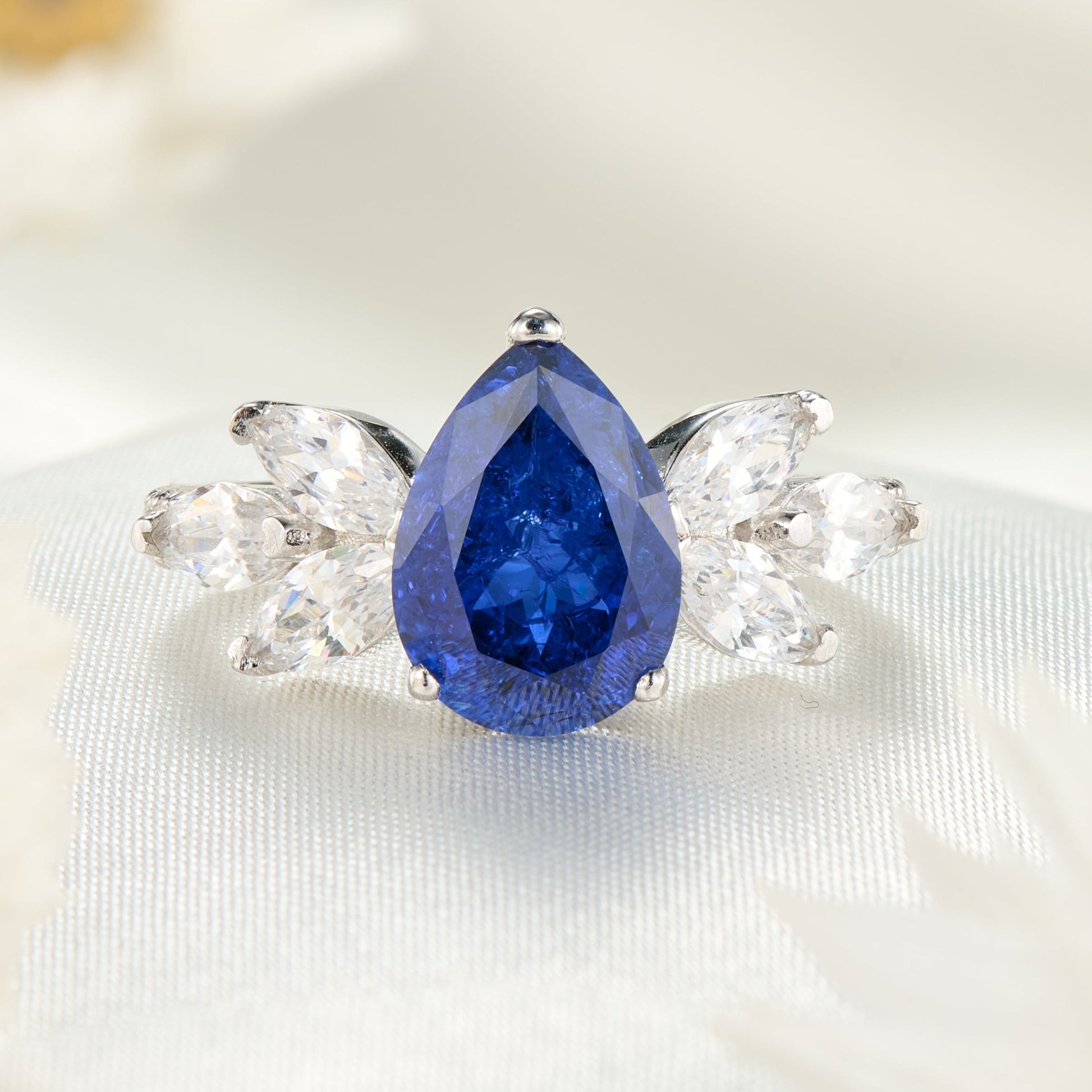 The Luna Pear Cut Lab Grown Royal Blue Sapphire Ice-crackle Texture Ring