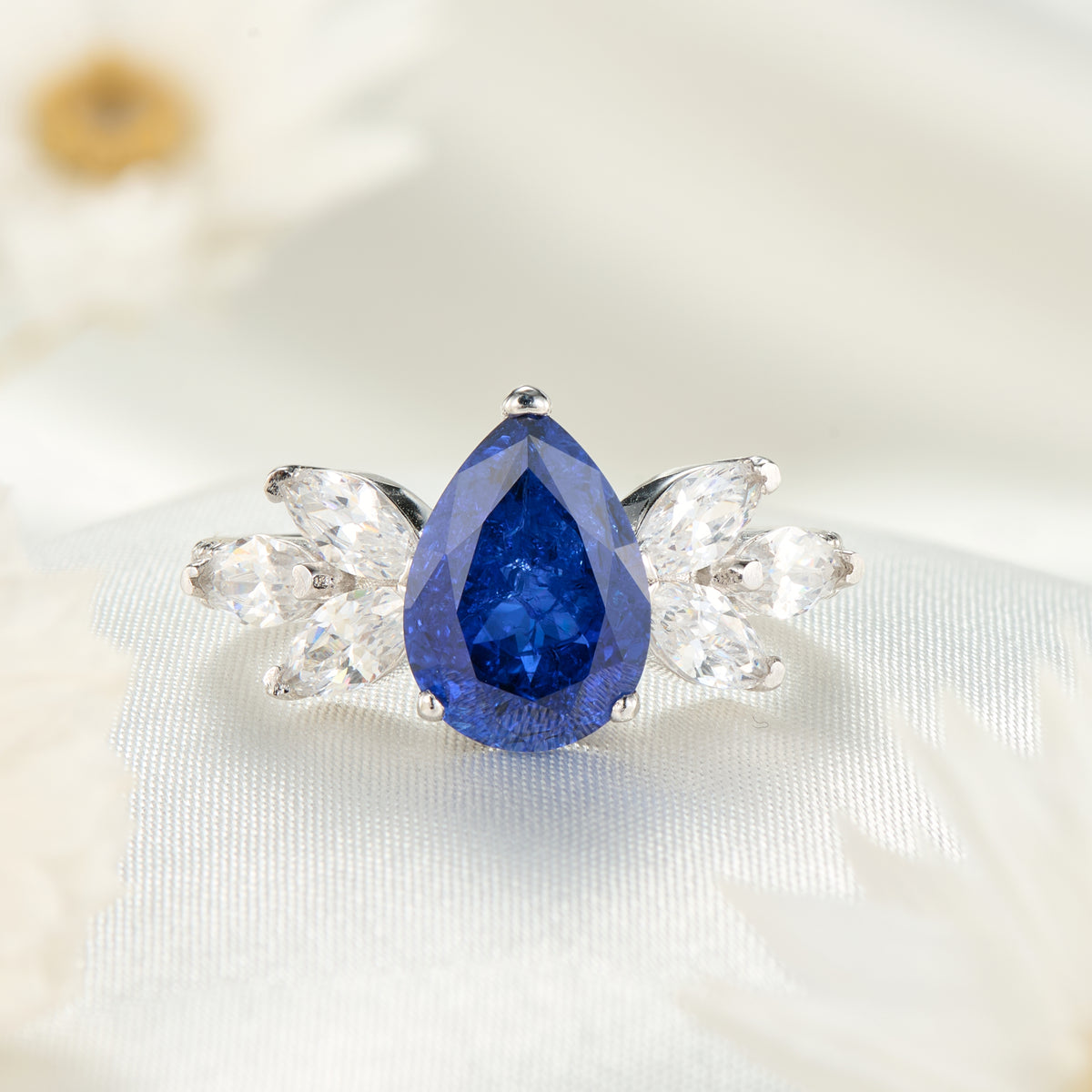 The Luna Pear Cut Lab Grown Royal Blue Sapphire Ice-crackle Texture Ring