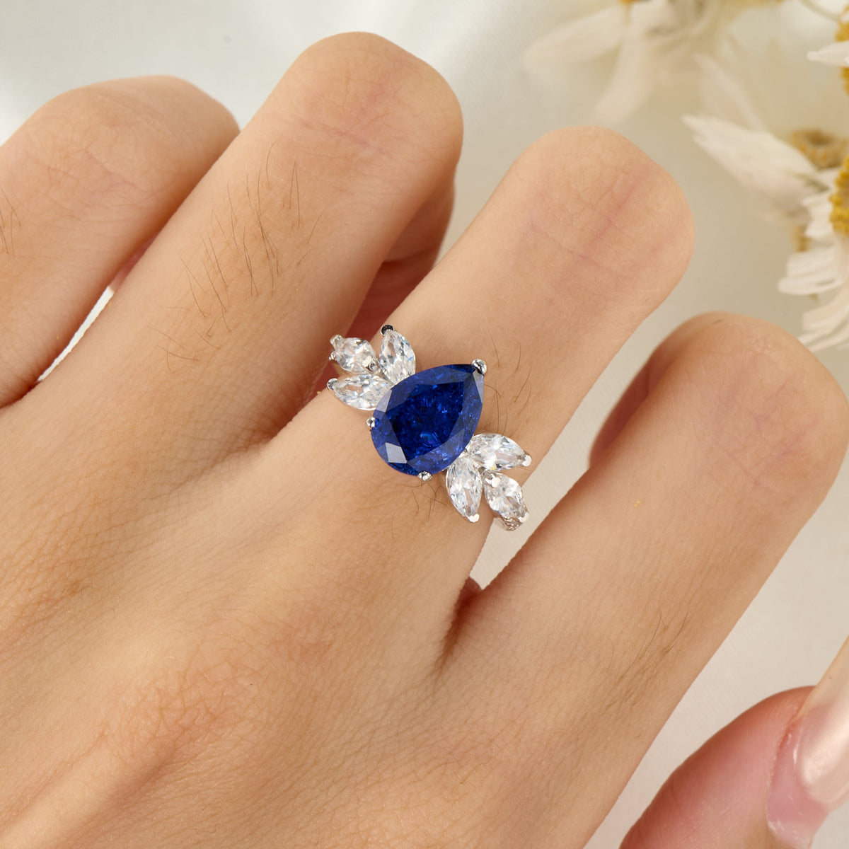 The Luna Pear Cut Lab Grown Royal Blue Sapphire Ice-crackle Texture Ring