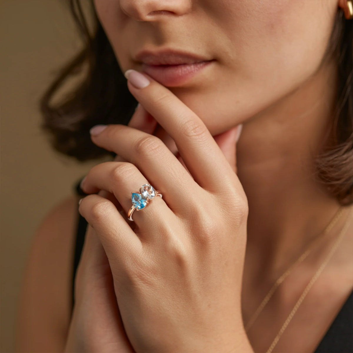 The Celestria 1CT Pear Cut Blue Moissanite & 1CT Oval Cut Moissanite Ring