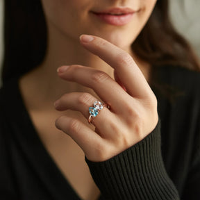 The Celestria Pear Cut Blue Moissanite & Oval Cut Moissanite Ring