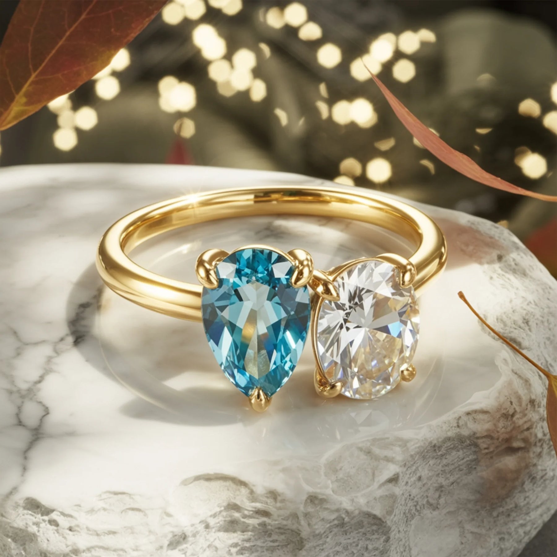 The Celestria Pear Cut Blue Moissanite & Oval Cut Moissanite Ring