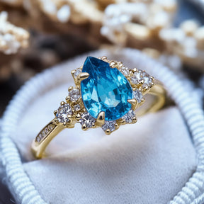 The Bethany Pear Cut Blue Moissanite Halo Ring