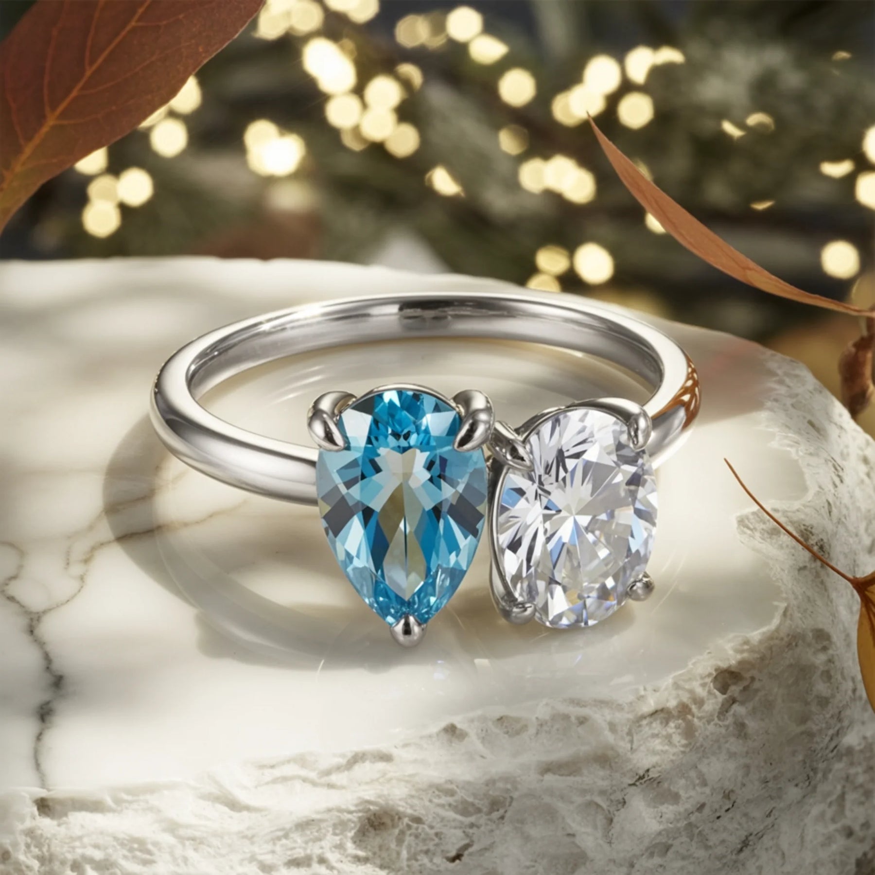 The Celestria Pear Cut Blue Moissanite & Oval Cut Moissanite Ring