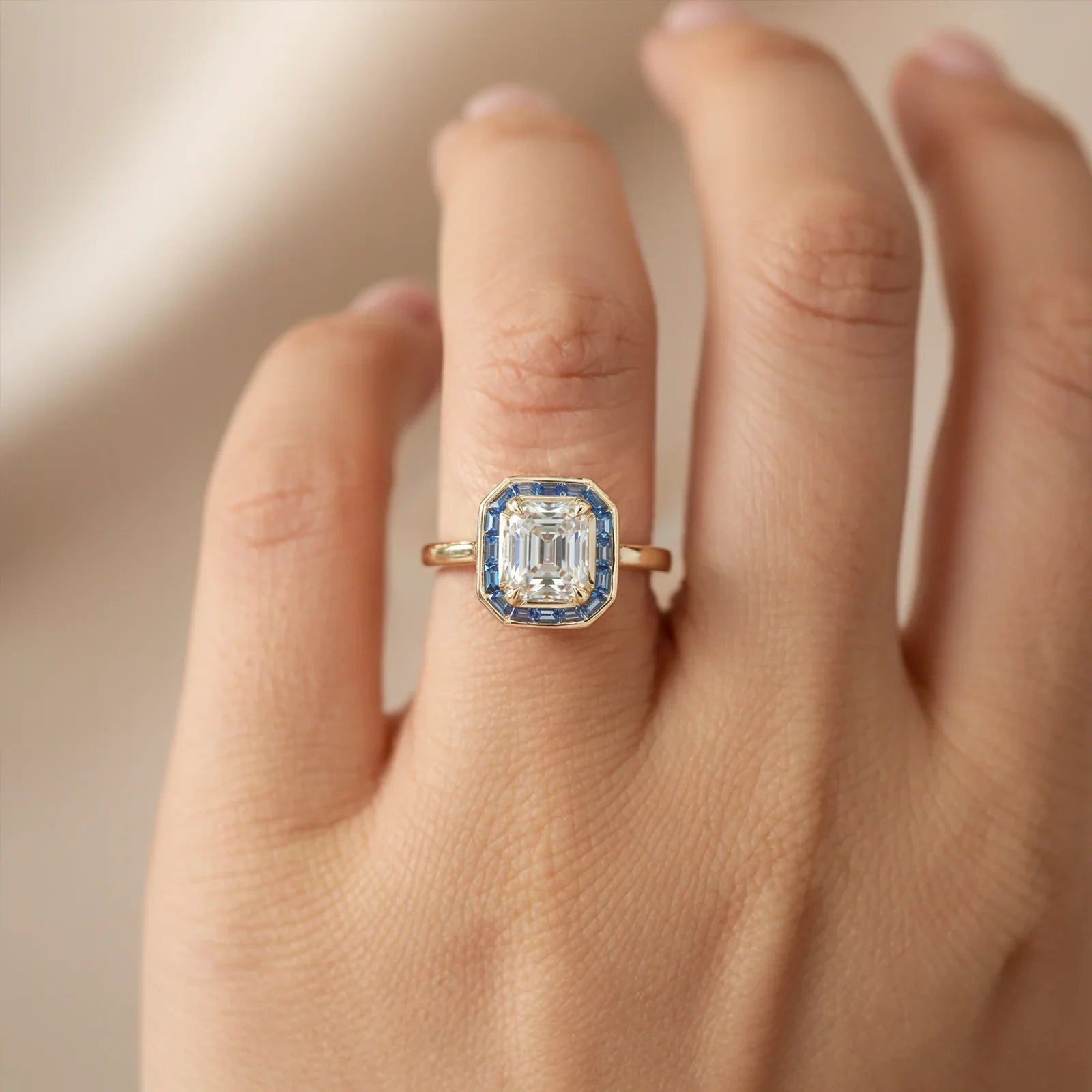 The Indigo Whisper Emerald Cut Halo Moissanite Ring