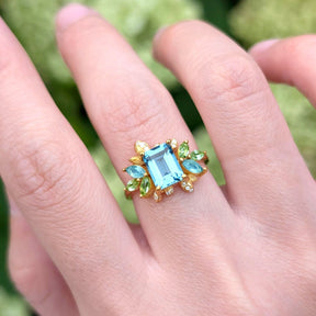 Blooming 1CT Emerald Cut Blue Gemstone Leafy Halo Engagement Ring