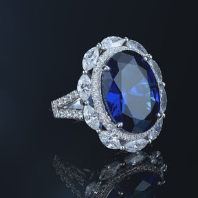 Dissoo® Oval Cut Royal Blue Ring with Flower Cluster